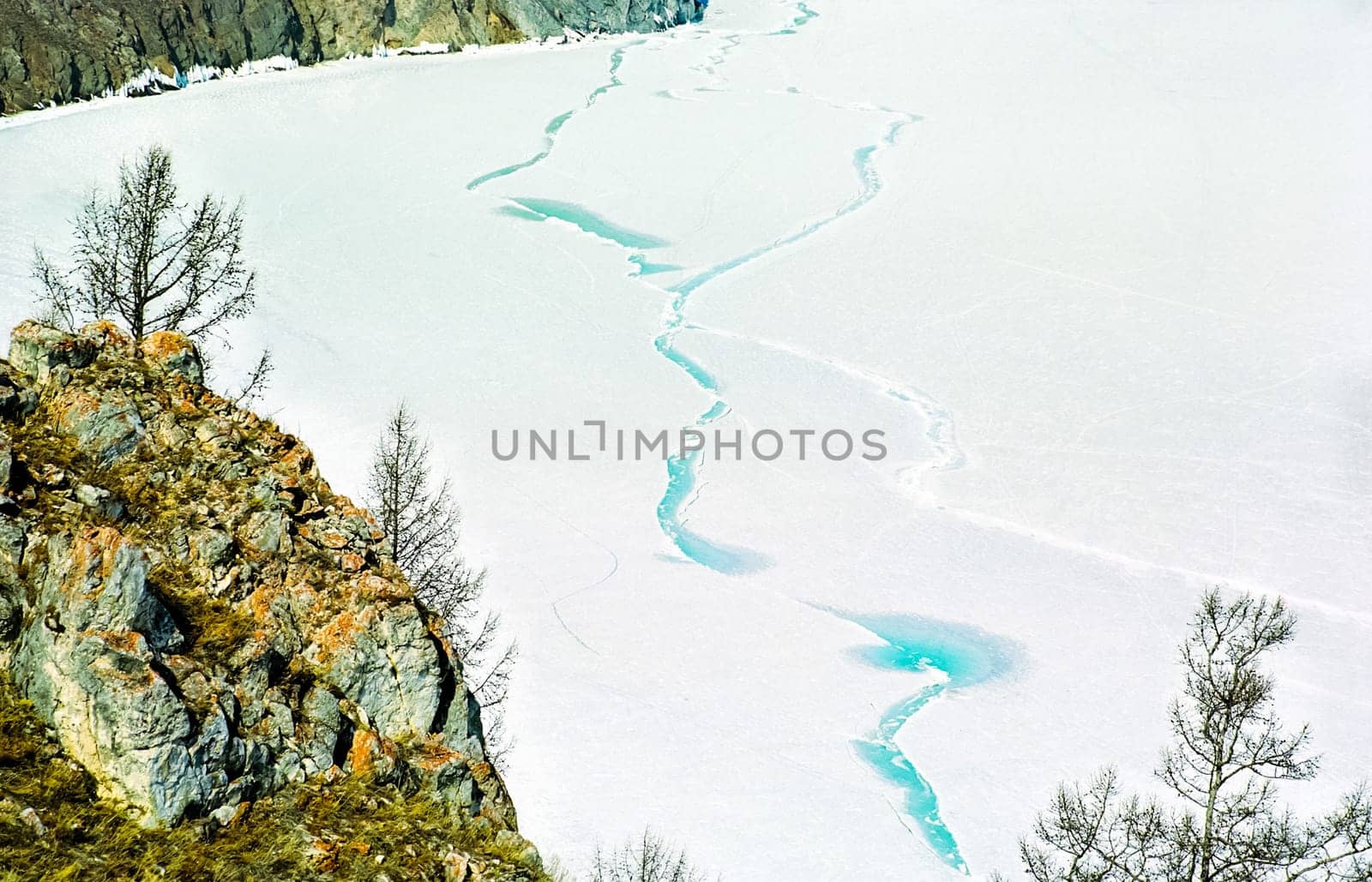 Winter on the Baikal, ice and snow on the lake. The beauty of the nature of Baikal in winter.