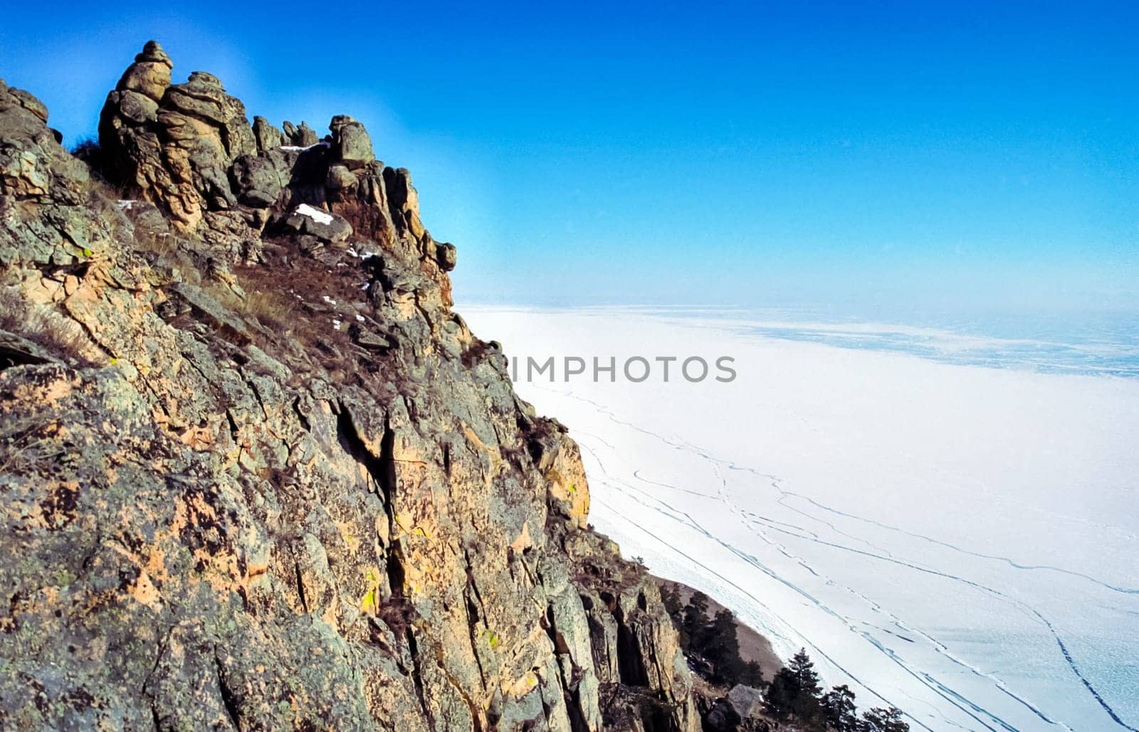 Winter on the Baikal, ice and snow on the lake. The beauty of the nature of Baikal in winter.