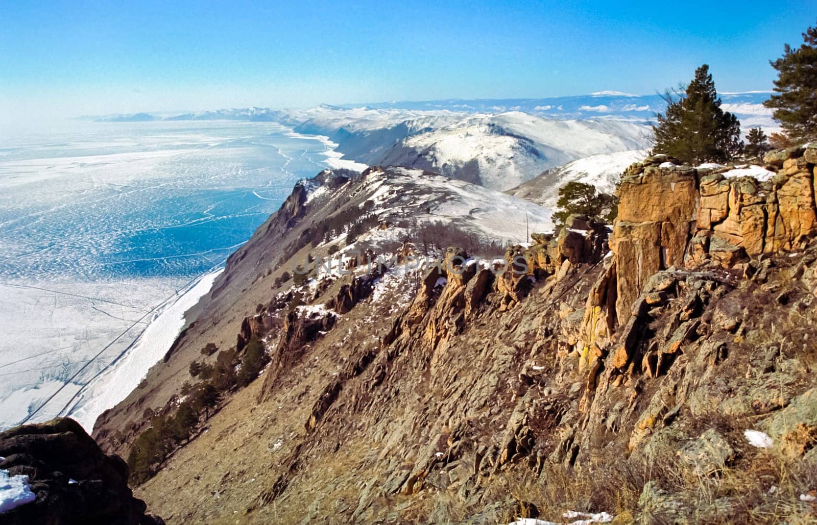 Winter on the Baikal, ice and snow on the lake. The beauty of the nature of Baikal in winter.