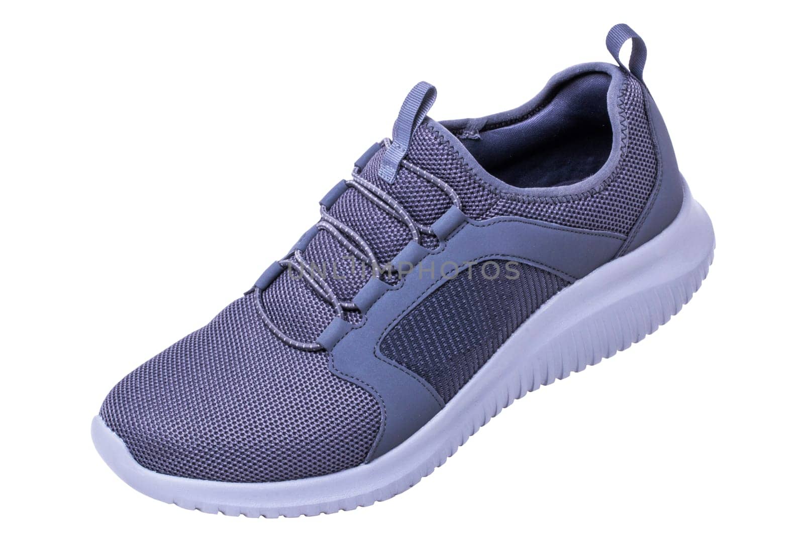 Closeup of a pair of modern silver gray sneakers or sports shoes isolated on a white background. Clipping path. Elegant and trendy mans shoes. Macro.