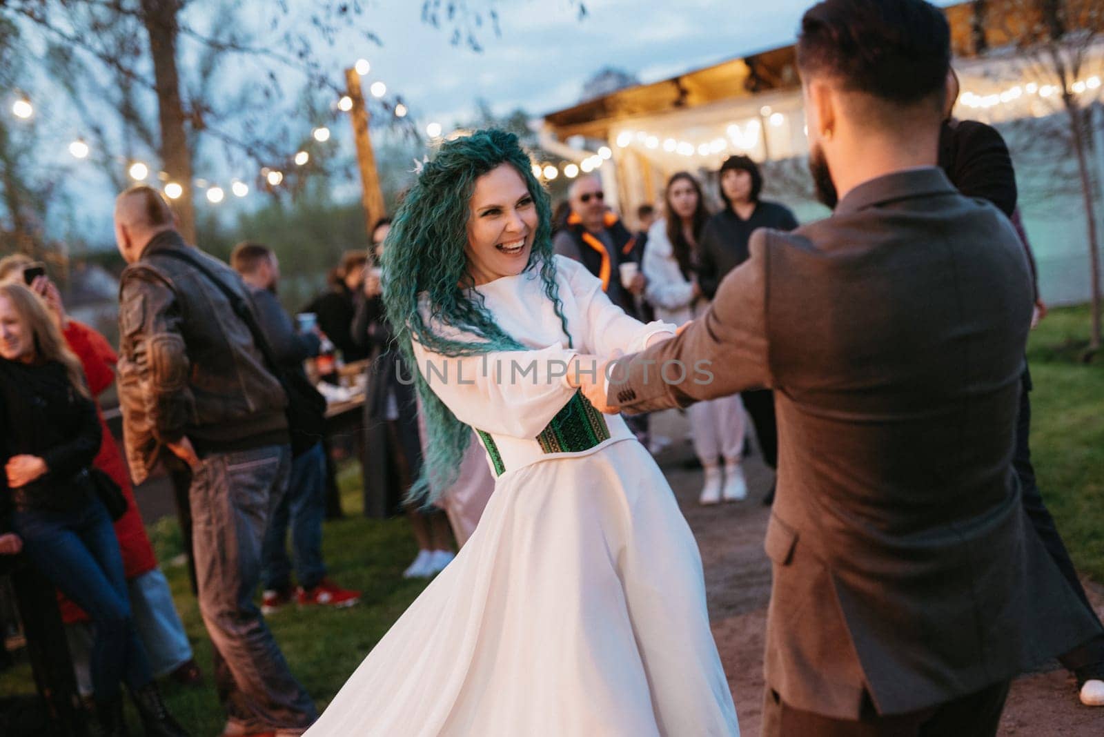 the first wedding dance of the bride and groom in the glade of the country club