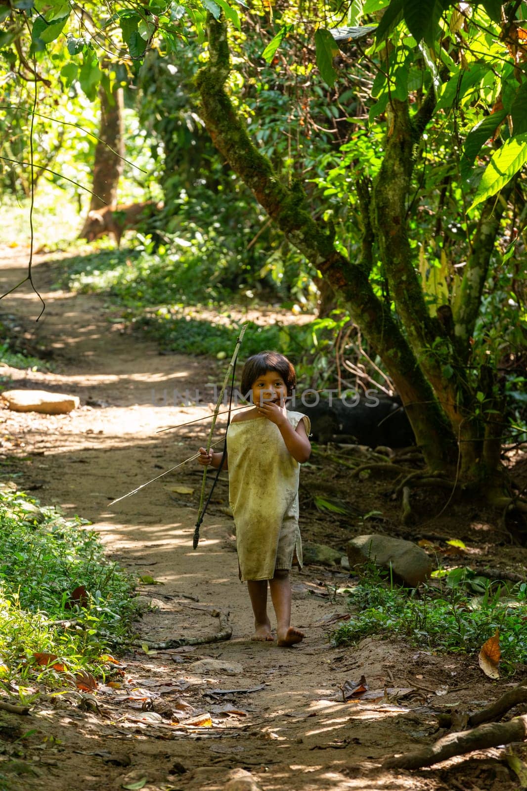 Tayrona, Magdalena, Colombia - September 21 2023: Indigenous Koguis boy in the road to Ciudad Perdida, Magdalena, Sierra Nevada de Santa Marta, Colombia