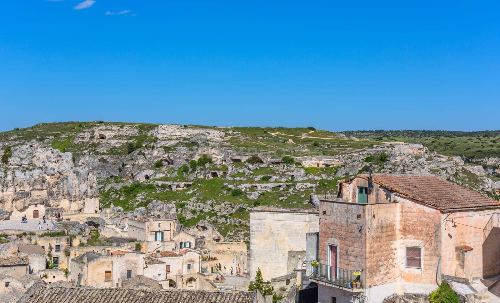 Matera, Italy - 6 May 2023: Ancient Unesco heritage old town of Matera (Sassi di Matera), Basilicata, southern Italy. Prehistoric cave dwellings