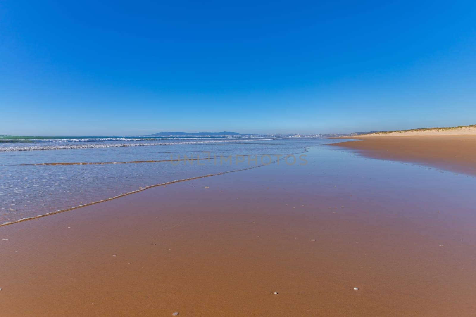 Atlantic Ocean at Costa da Caparica beach, near Lisbon in Portugal.
