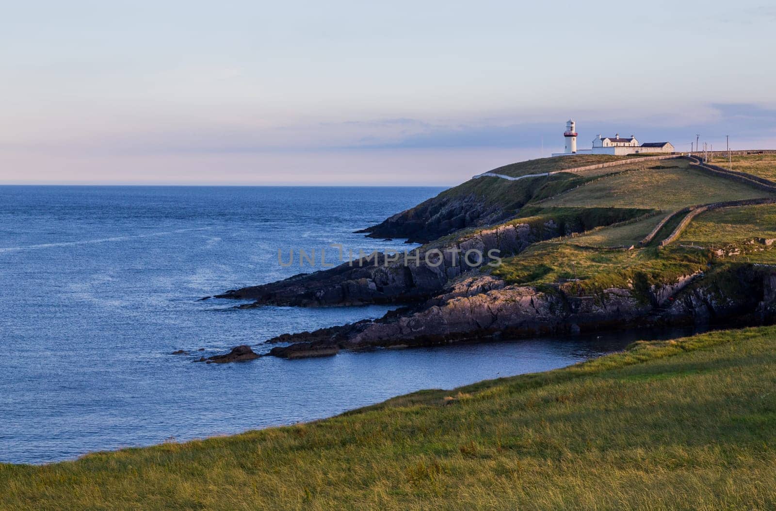 View to Galley Head Lighthouse on picturesque coastline in County Cork,Ireland.