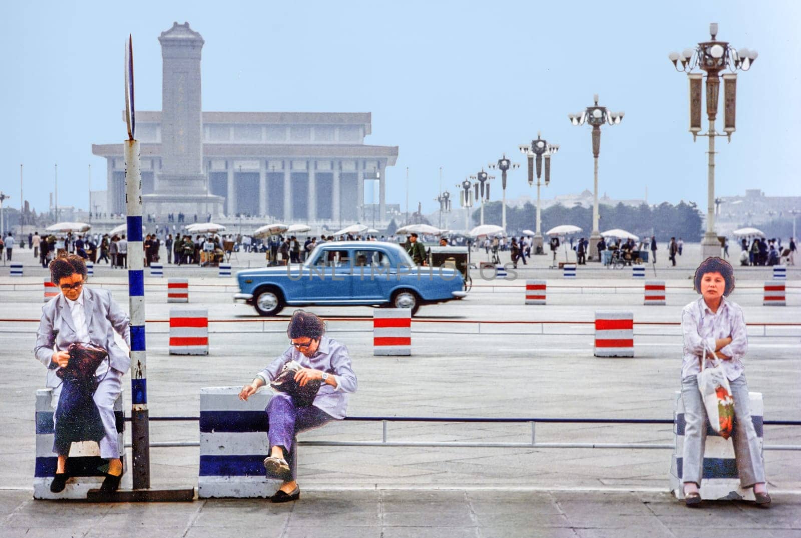 Beijing, China - September 22, 1981: women sit at the Tianmen square in china with very low traffic.