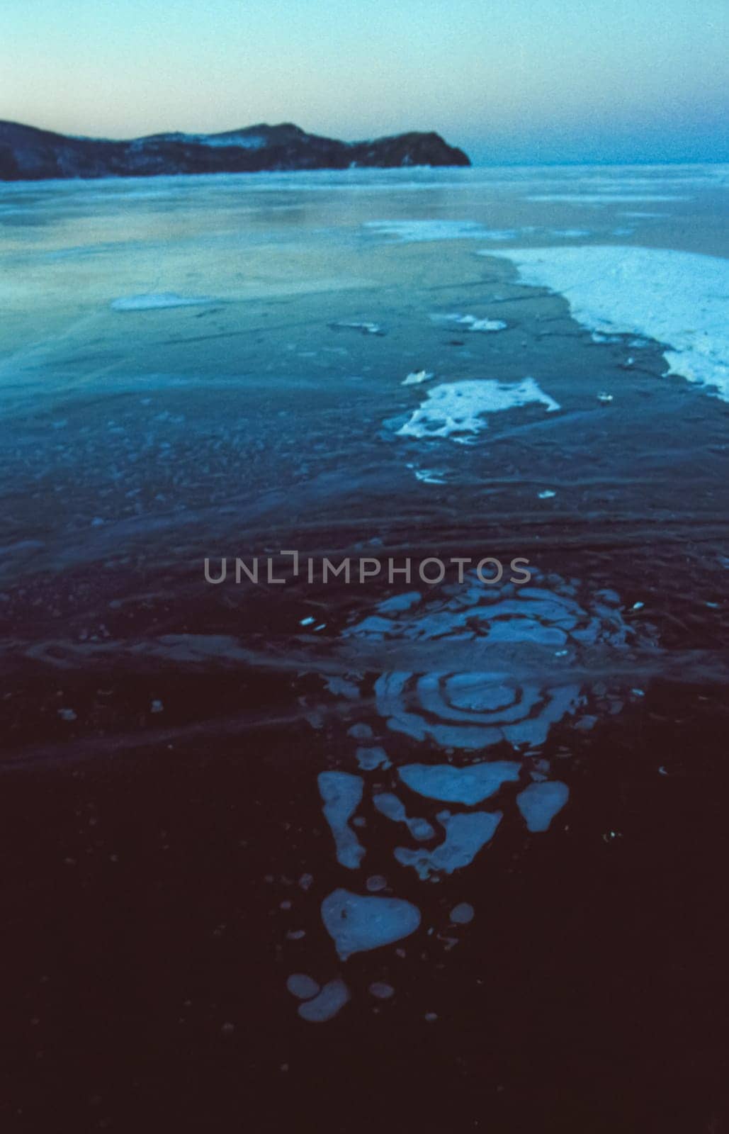 Winter on the Baikal, ice and snow on the lake. The beauty of the nature of Baikal in winter.
