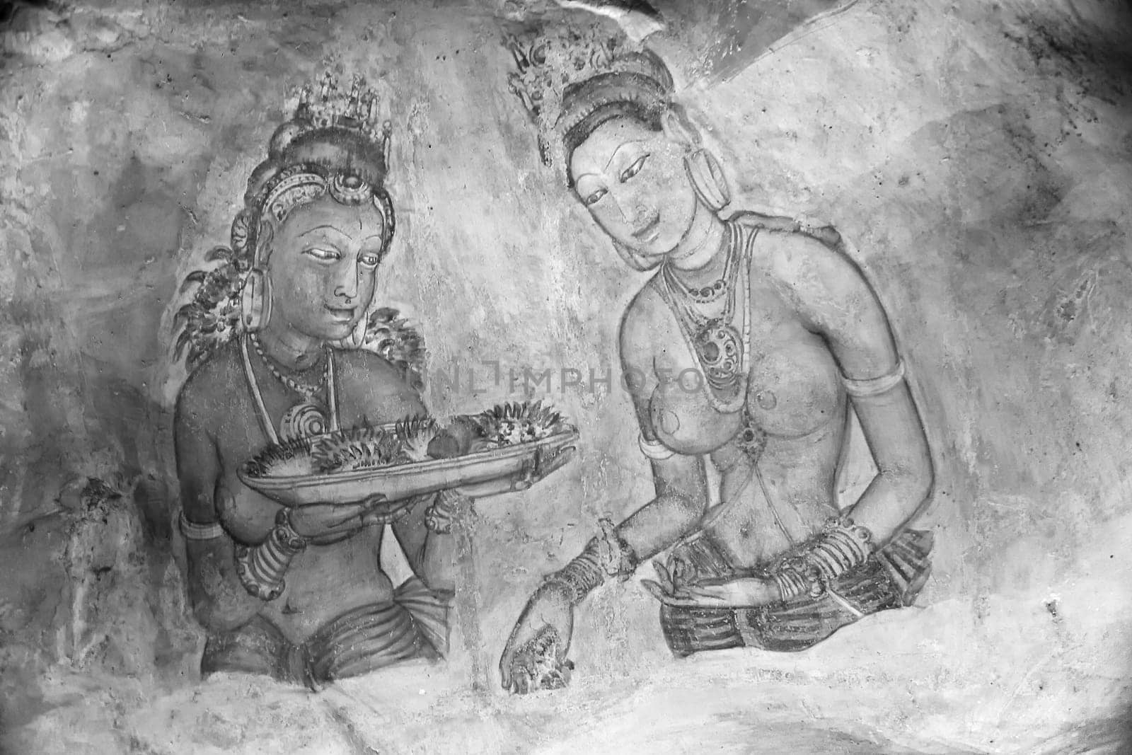 Sigiriya, Sri Lanka - August 9, 2005: Sigiriya Maidens fresco  in Sigiriya, Sri Lanka. Sigiriya Maidens frescoes were painted at Sigiriya rock in five century.