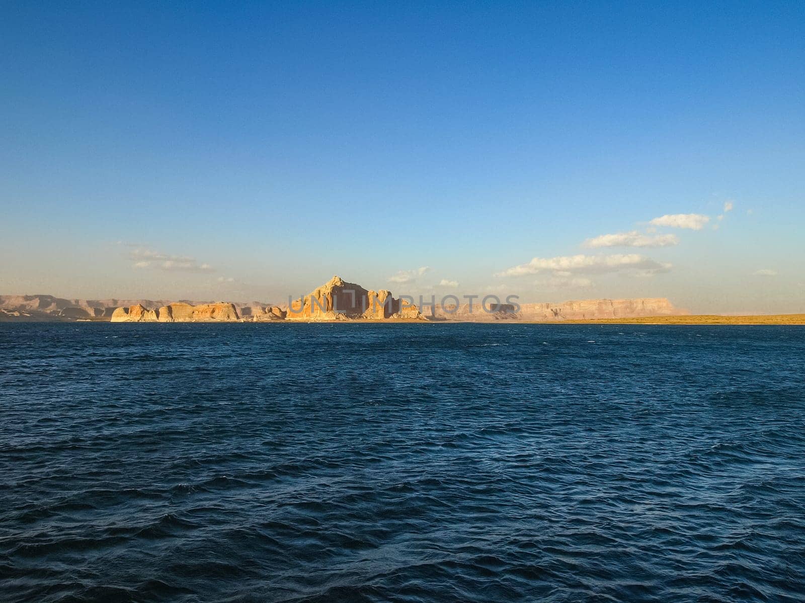 Lake Powell is based on Colorado River with a great view on the canyoon. Beautiful canyon and lonely rocks on the Lake Powell, Utah.