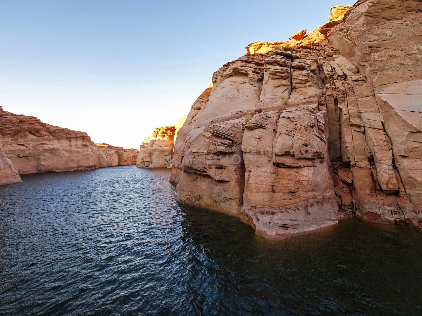 Lake Powell is based on Colorado River with a great view on the canyoon. Beautiful canyon and lonely rocks on the Lake Powell, Utah.