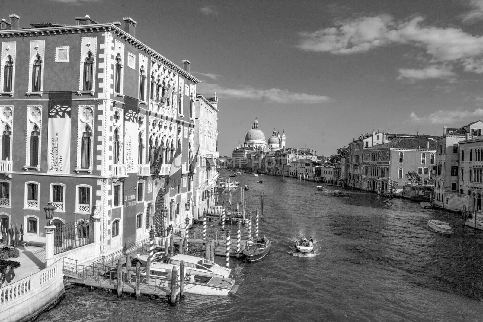 Venice, Italy - September 25, 2005: view to canale Grande in Venice with boats and historic villas.
