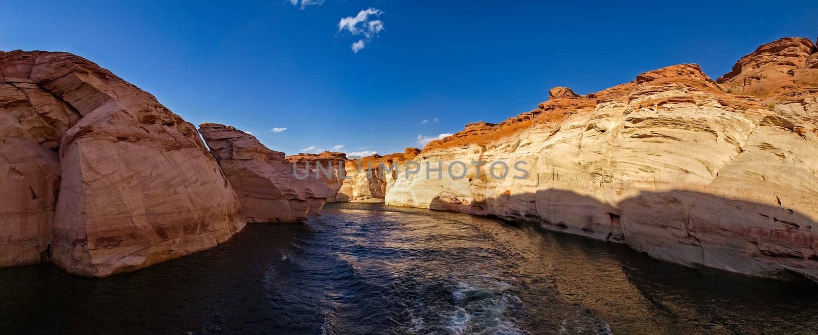 Lake Powell is based on Colorado River with a great view on the canyoon. Beautiful canyon and lonely rocks on the Lake Powell, Utah.
