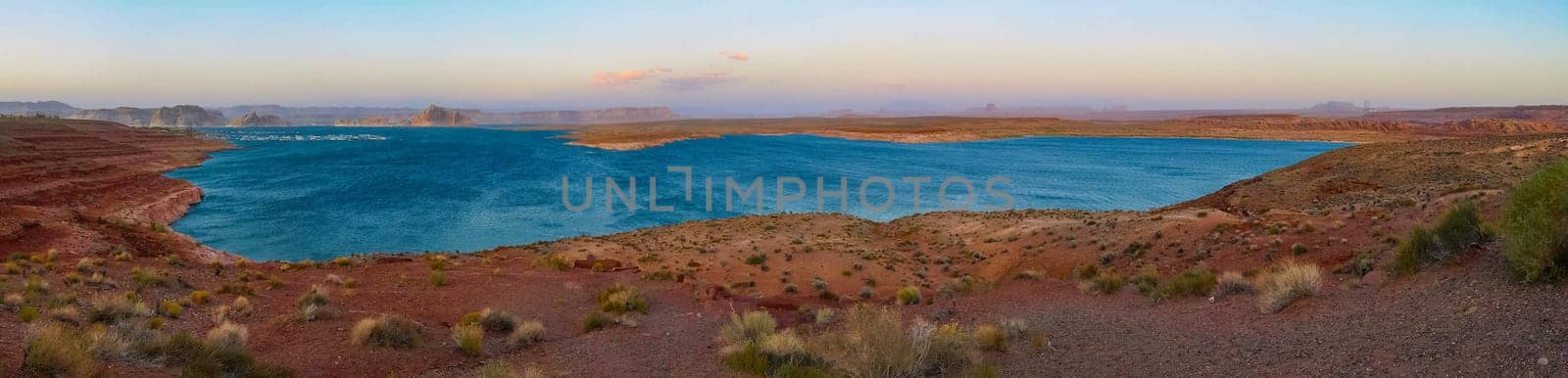 Lake Powell is based on Colorado River with a great view on the canyoon. Beautiful canyon and lonely rocks on the Lake Powell, Utah.