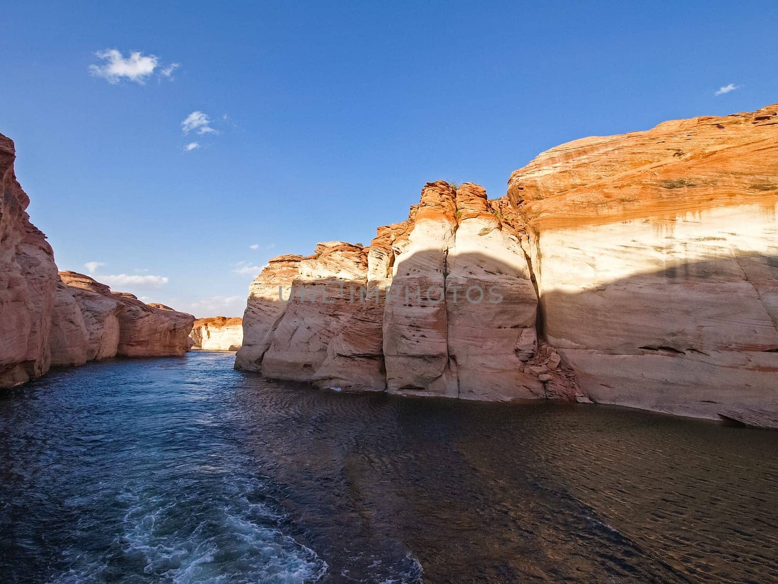 Lake Powell is based on Colorado River with a great view on the canyoon. Beautiful canyon and lonely rocks on the Lake Powell, Utah.