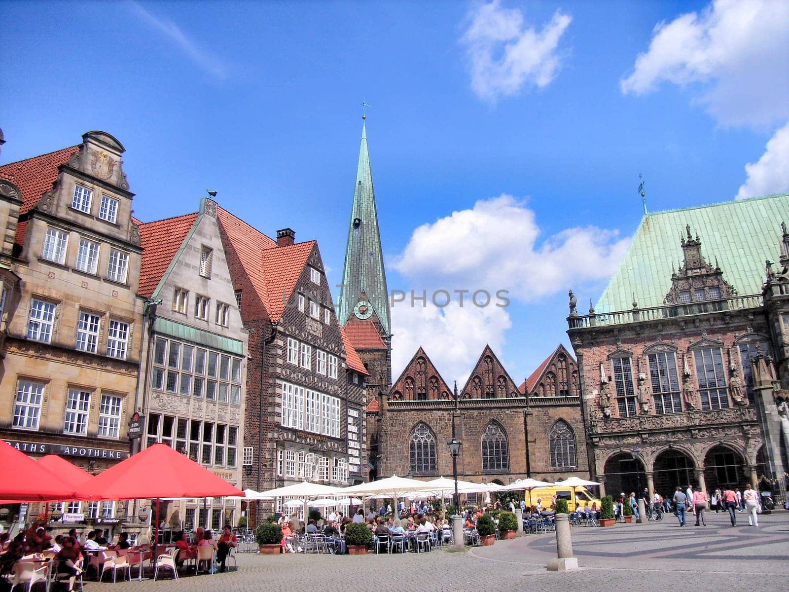 Bremen, Germany - July 22, 2007: view to old town hall of Bremen and the market square with restaurants and tourists.