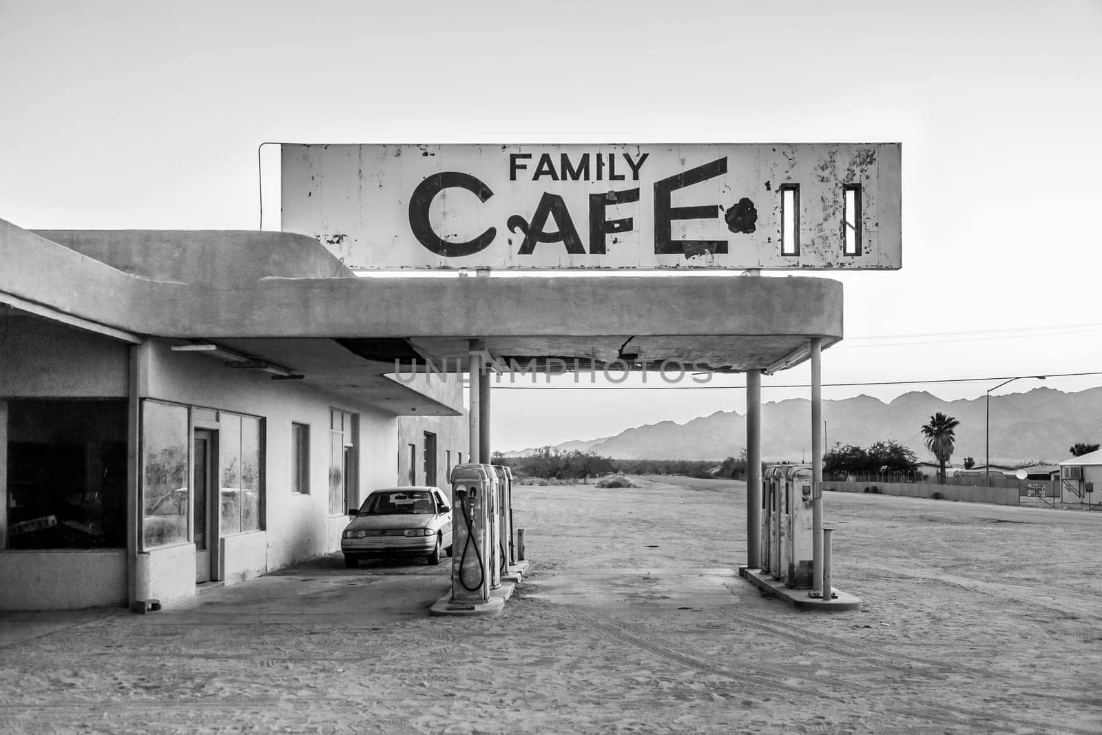 Desert Center, USA - July 7, 2008: abandoned petrol station in the desert village of Desert Center in sunset.