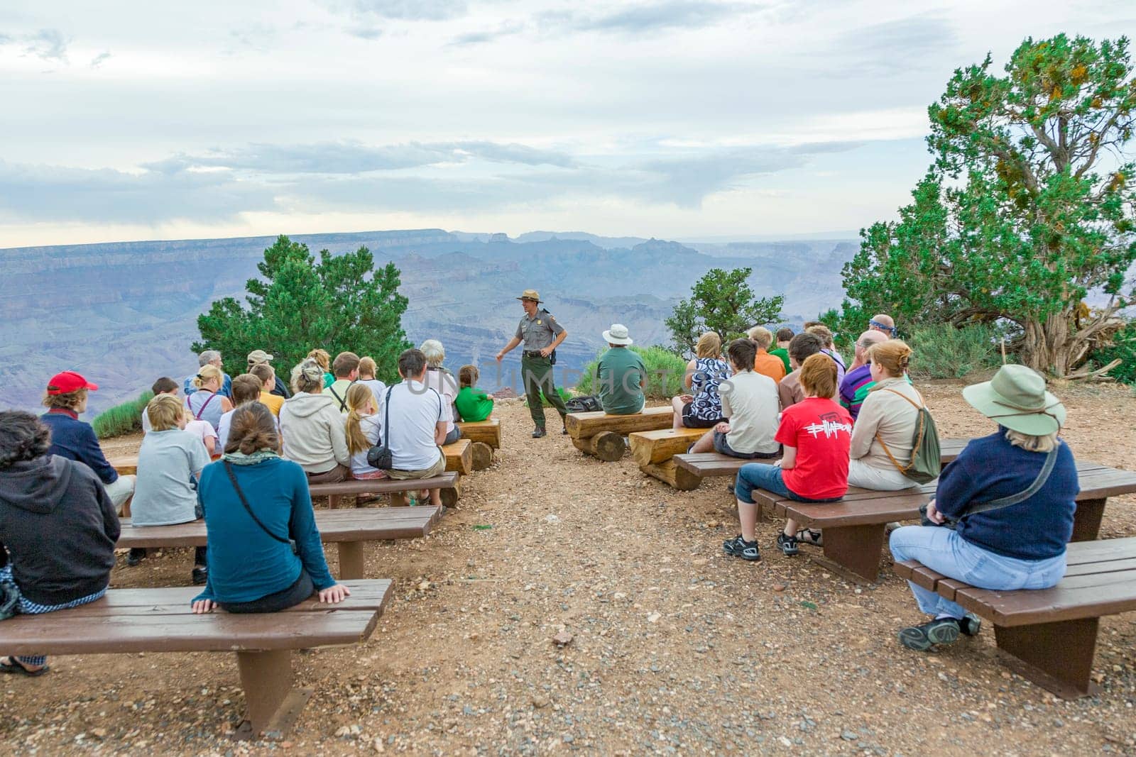 Grand Canyon, USA - July 10, 2008: park ranger explains the geology of the Grand canyon at Hopi point to tourists.