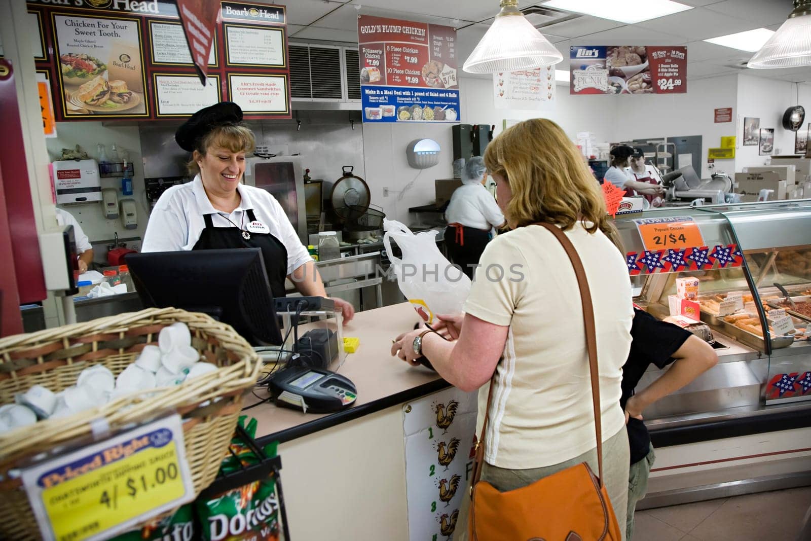 Hurricane, USA - July 17, 2008: supermarket employees in a supermarket selling sandwiches and sweets to tourists in Hurricane, USA.