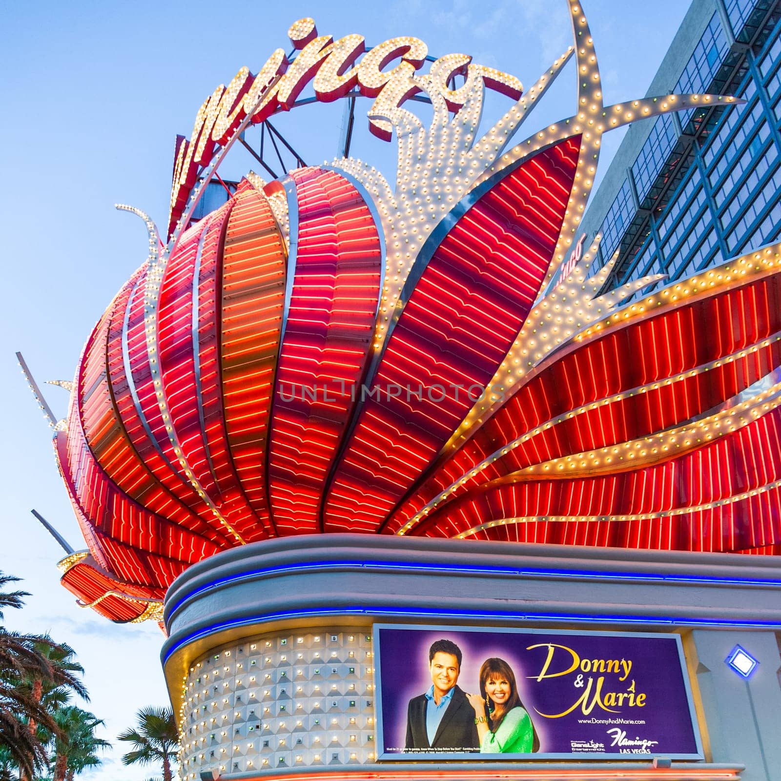 Las Vegas, USA - July 17, 2008: The  Flamingo hotel and gambling place on the Las Vegas Strip in the late afternoon in neon light in Las Vegas, USA.