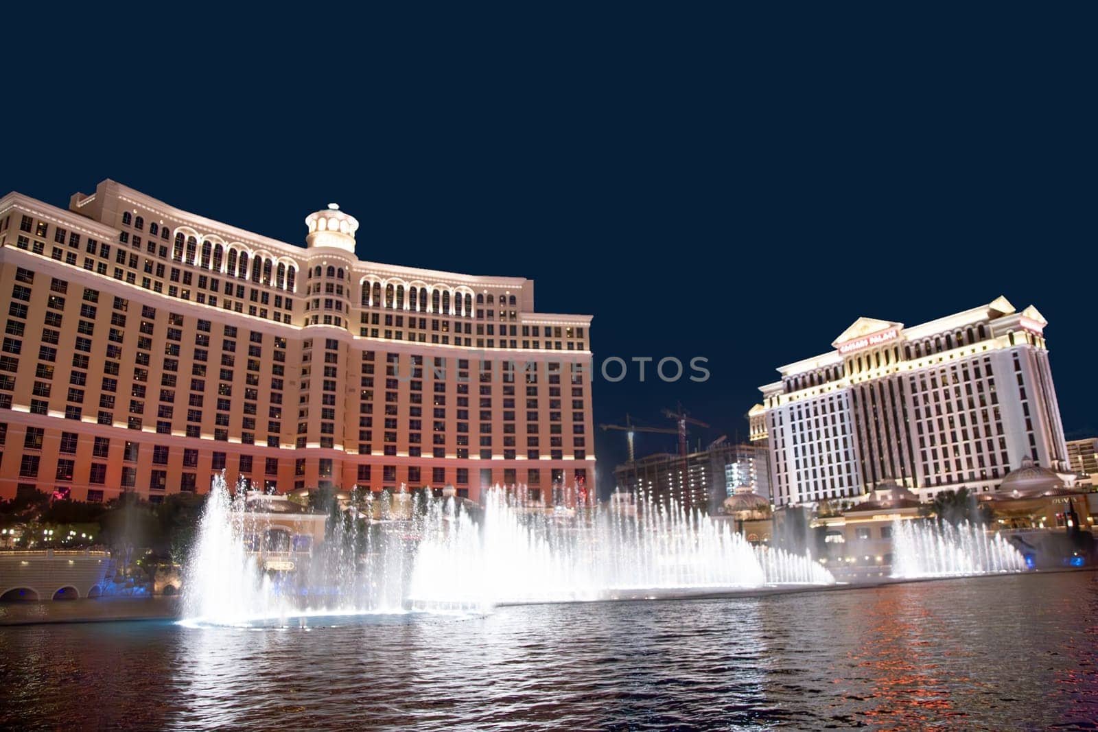 Las Vegas, USA - July 17, 2008:  Las Vegas Bellagio Hotel Casino, featured with its world famous fountain show, at night with fountains  in Las Vegas, Nevada.