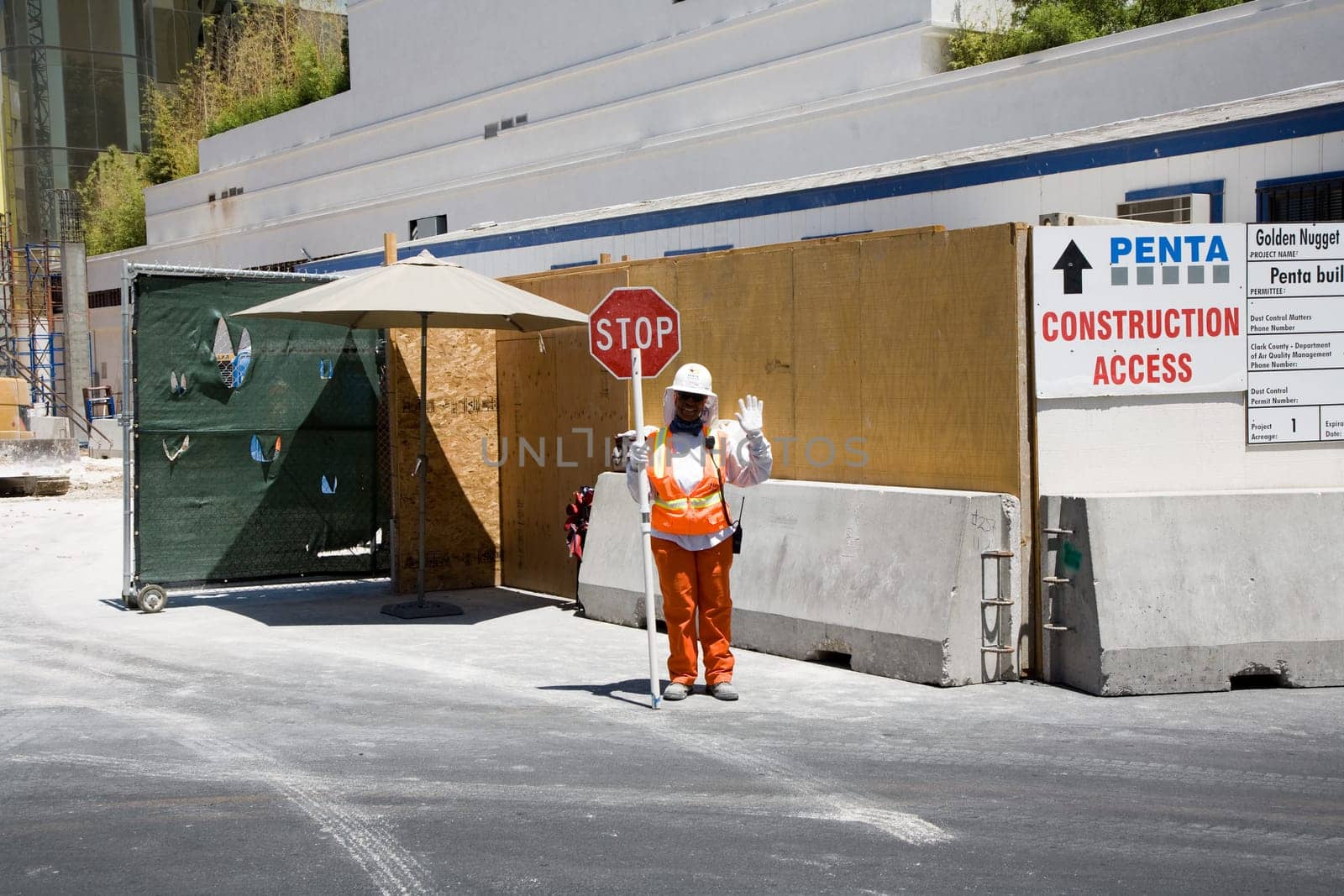 Las Vegas, USA - July 18, 2008: Woman assecurity guard is regulating the access to the construction site in Las Vegas, USA.