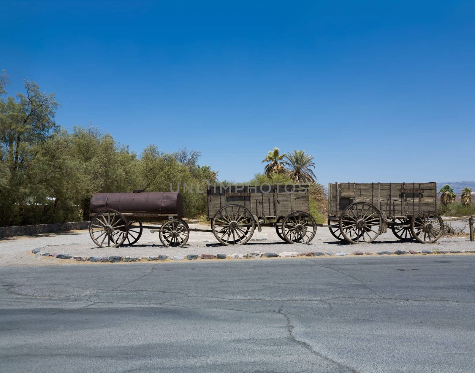 Death Valley, USA - July 19, 2008: old waggon at the entrance of the Furnance Creek Ranch in the middle of Death Valley, with these wagons the first men crossed the death valley in the 19th century