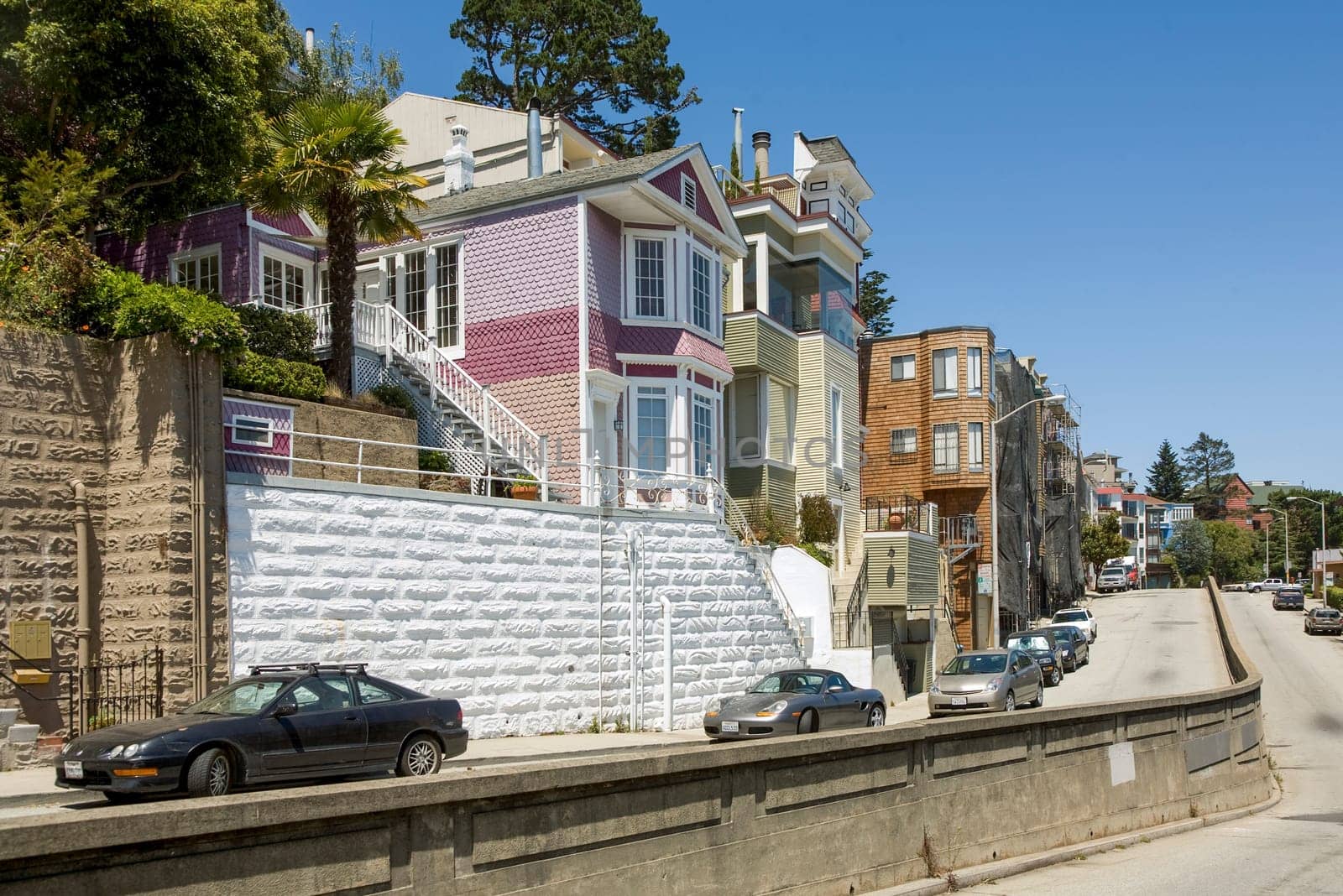 San Francisco, USA - July 23, 2008: view to famous street in San Francisco with old manisons made of wood in victorian style.