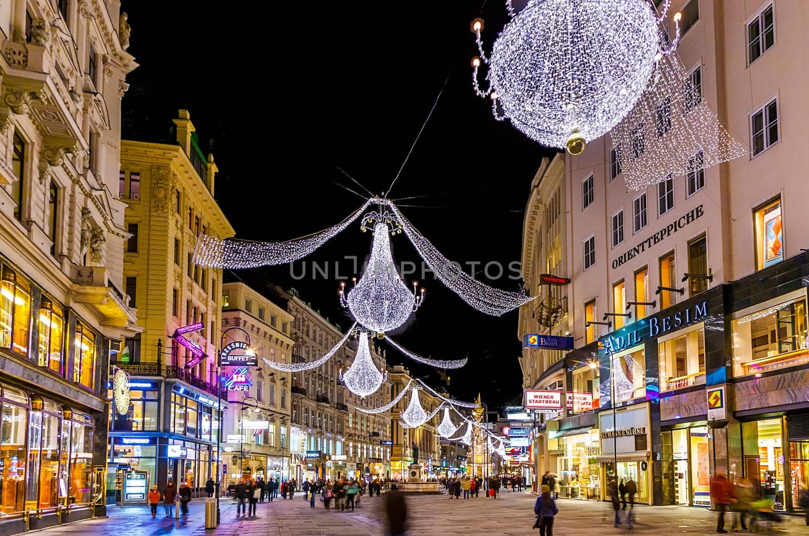 Vienna, Austria - December 9, 2009: famous Graben street at night with rain reflection on the cobbles in Vienna, Austria.
