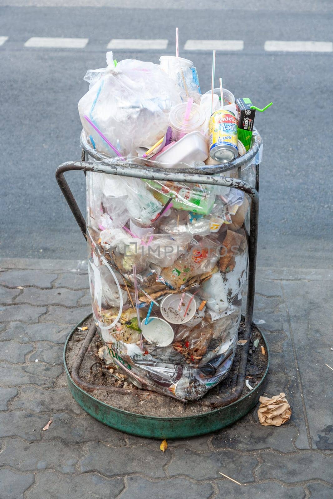 Bangkok, Thailand - December 22, 2009: trash can full of plastic litter in Bangkok, Thailand.