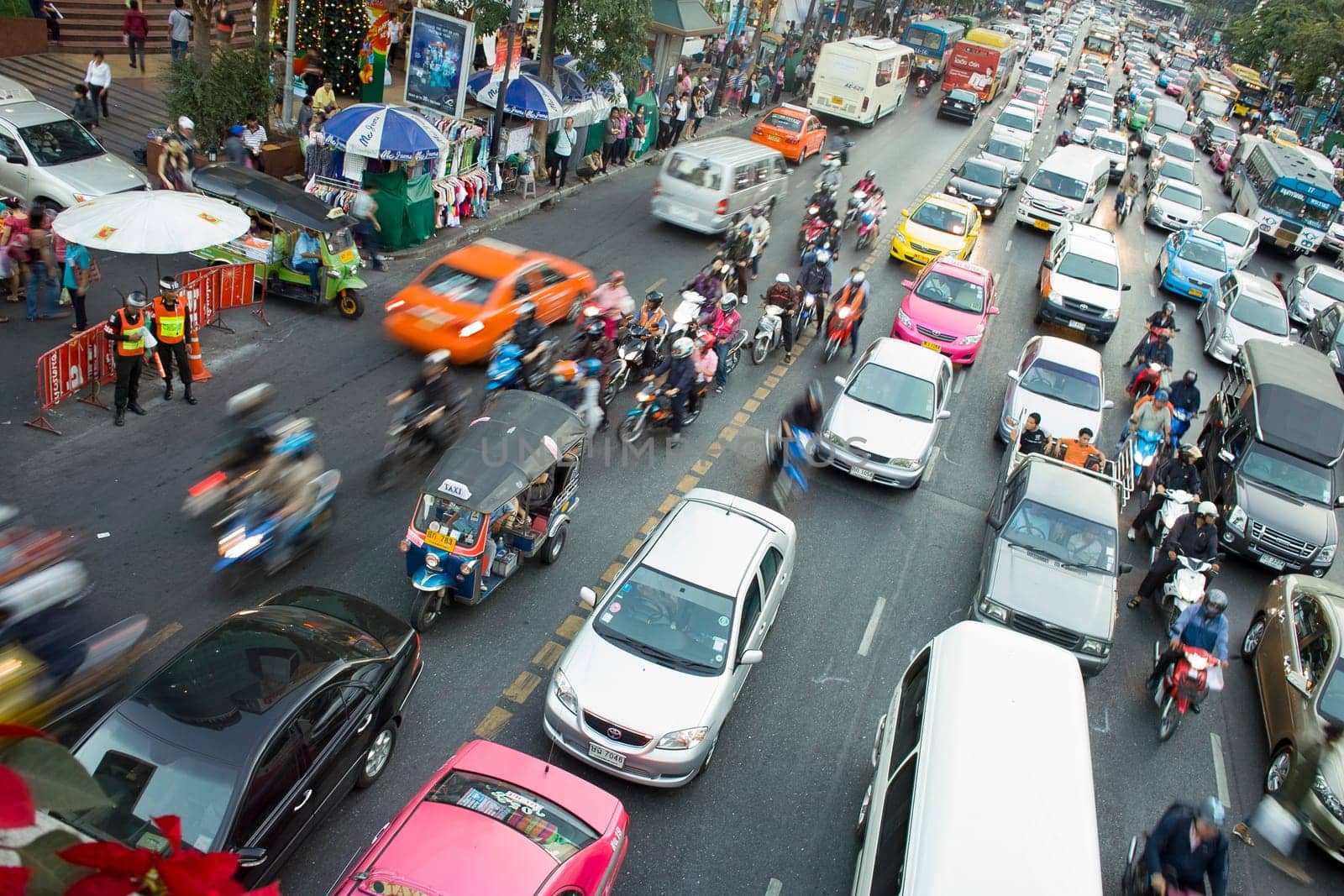 Bangkok, Thailand - December 22, 2009: main road in Bangkok in afternoon traffic jam with cars near the CENTRAL shopping center, Sukhumvit in Bangkok, Thailand.
