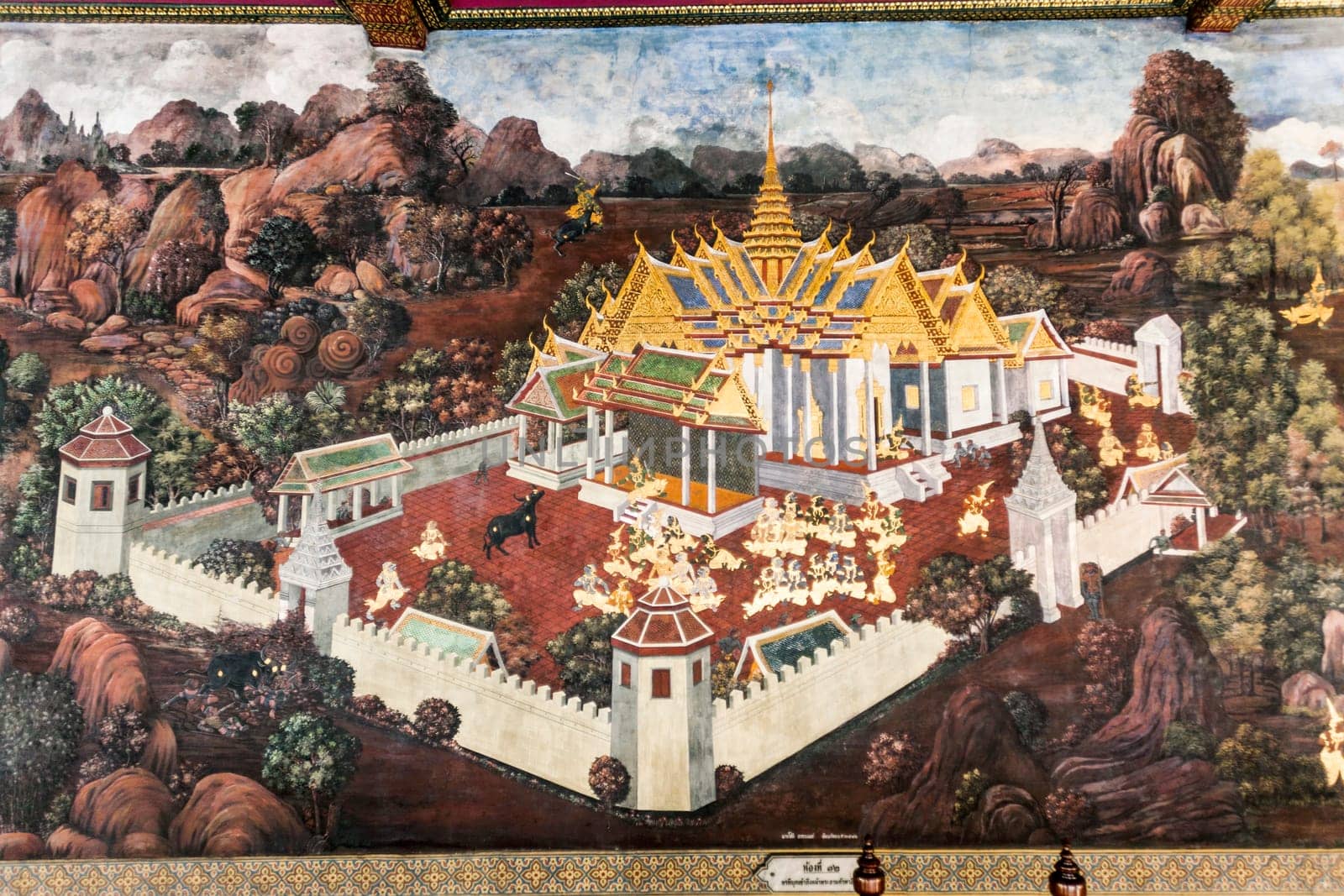 Bangkok, Thailand - January 4, 2010: mural painting at famous temple Phra Sri Ratana Chedi covered with foil gold in the inner Grand Palace.