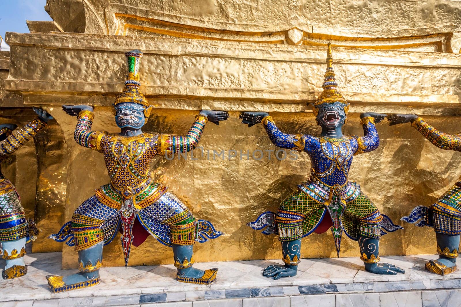 Bangkok, Thailand - January 4, 2010: a kinnari, a mythology figure, is watching the temple in the Grand Palace.