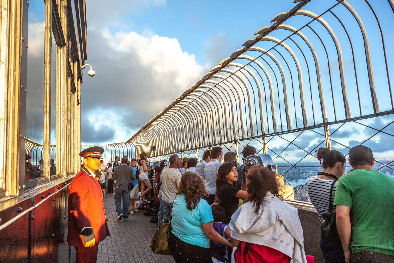 New York, USA - July 9, 2010: people enjoy the view to skyline of New York from empire state building.