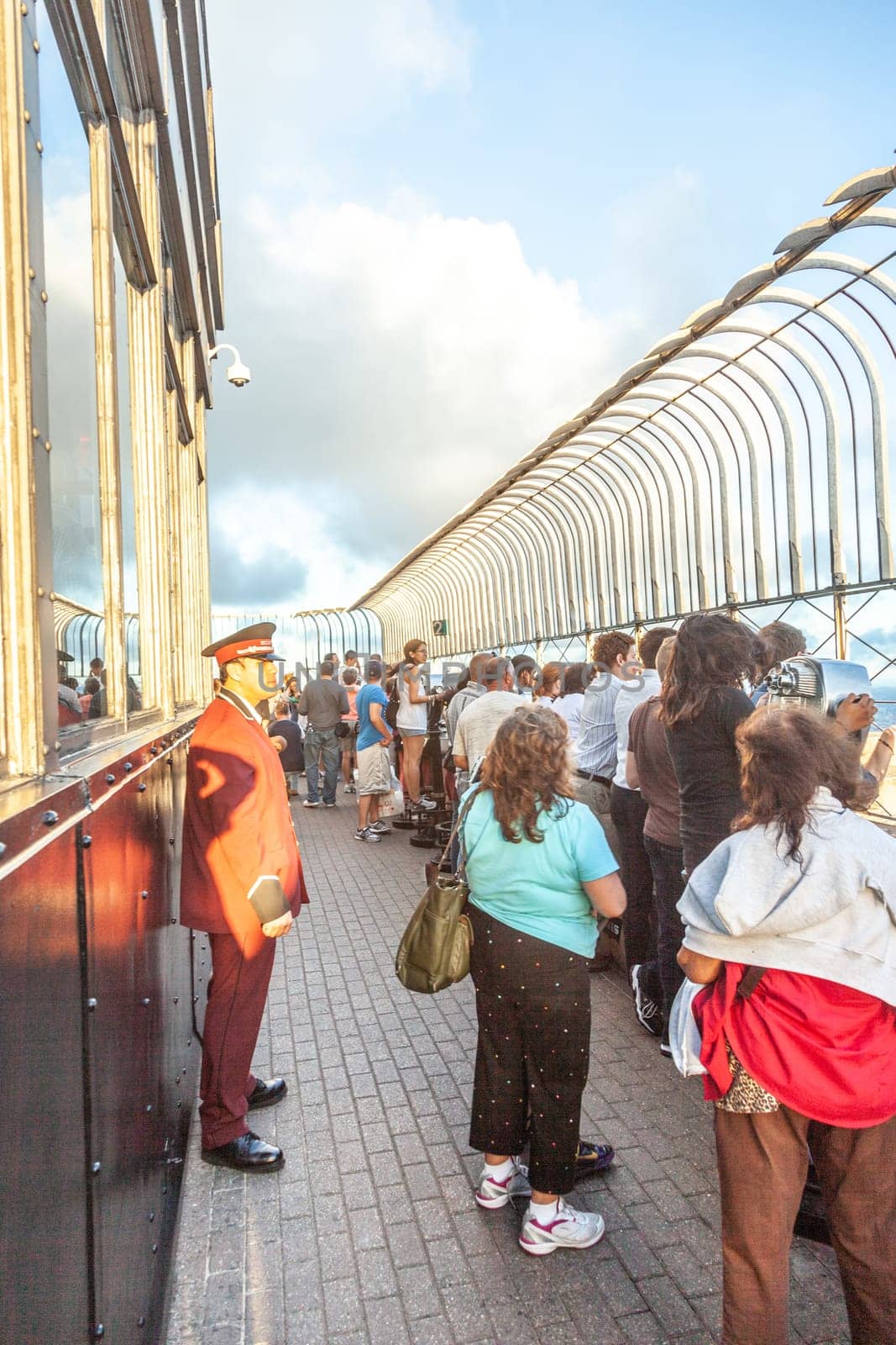 New York, USA - July 9, 2010: people enjoy the view to skyline of New York from empire state building.