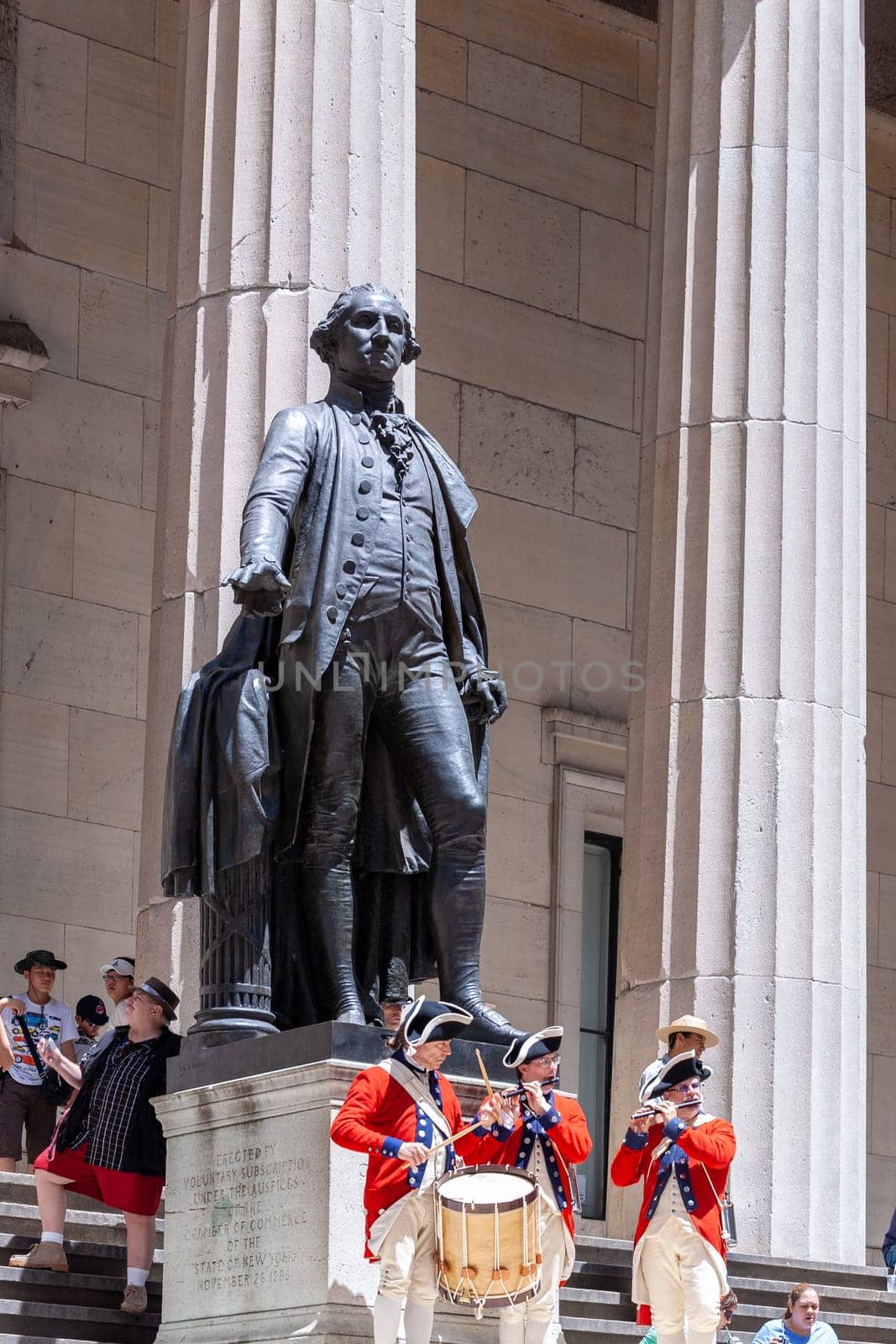 New York, USA - July 9, 2010: Ceremony for declaration of independence in old costumes takes place at the Washington statue in front of federal Hall National Memorial in New York, USA.