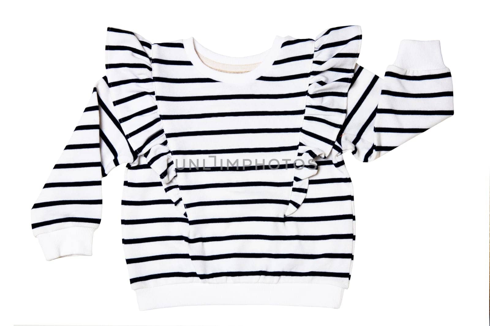 Denim shirt isolated. Closeup of a stylish black white striped shirt or t-shirt for child girl isolated. Clipping path. Kids summer fashion in marine style.