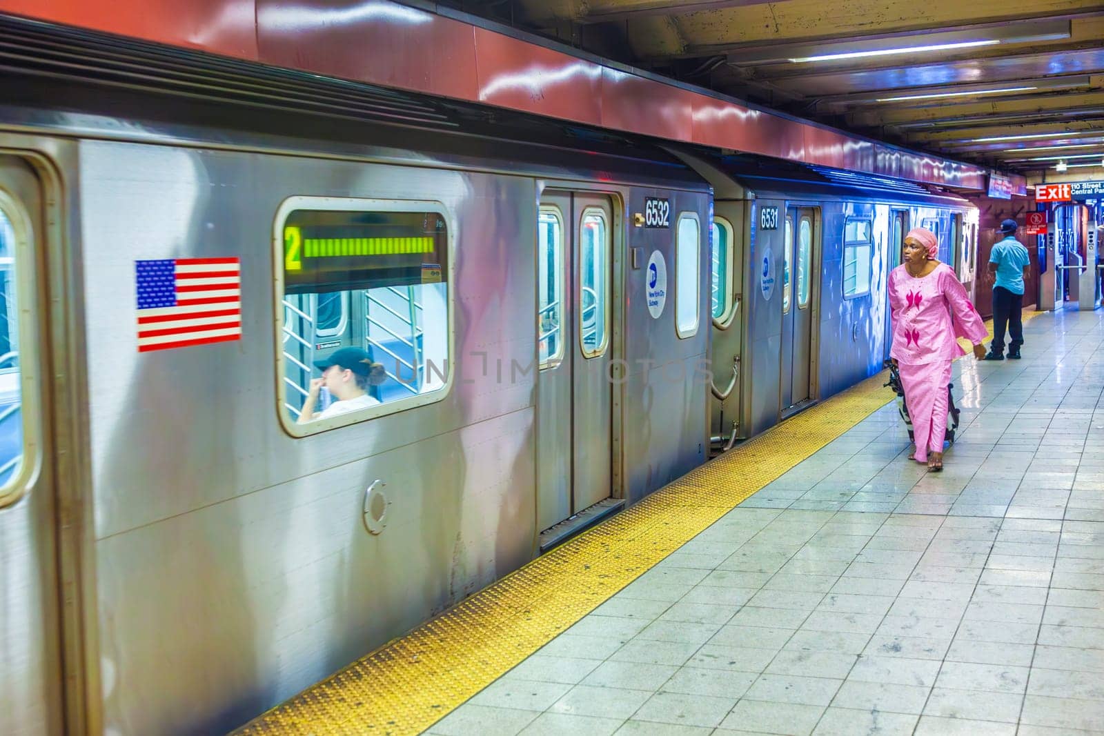 New York, USA - July 11, 2010:  people hurry to reach the train in Station Central Park  in New York City. The first underground line   opened on October 27, 1904 and is the forth busiest nowadays in the world.