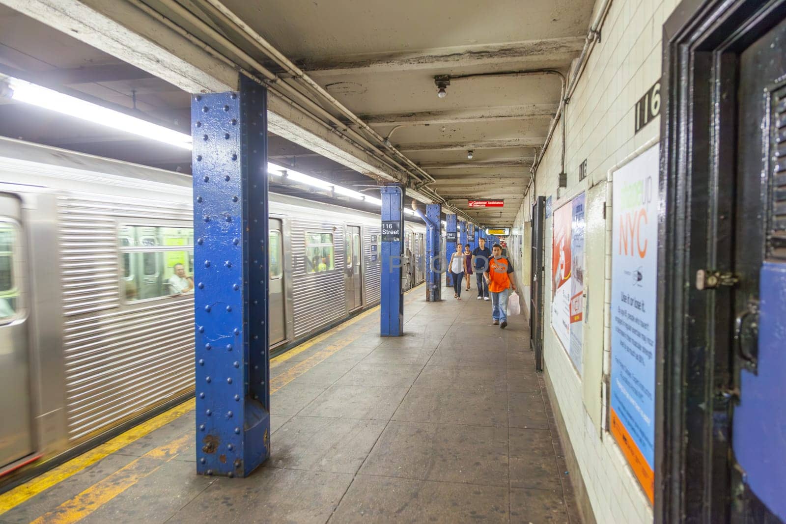 New York, USA - July 11, 2010: inside the Metro Station 116th street with people waiting for next Metro in New York.