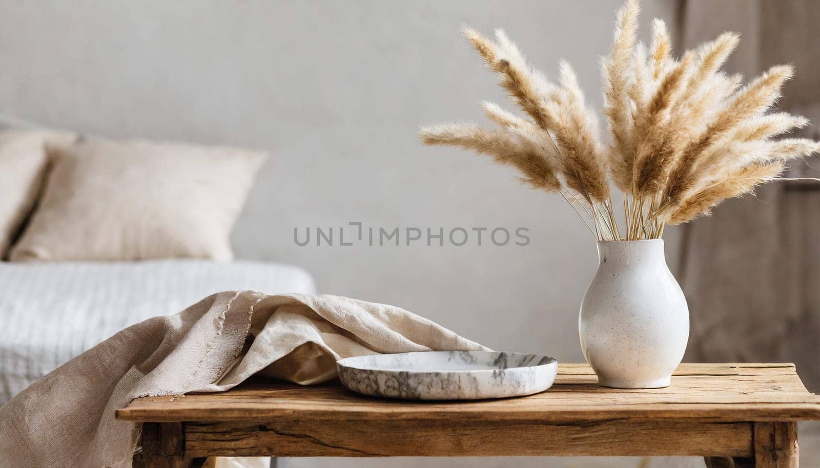 modern white ceramic vase with dry lagurus ovatus grass and marble tray on vintage wooden bench table blurred beige linen blanket in front scandinavian interior empty white wall copy space