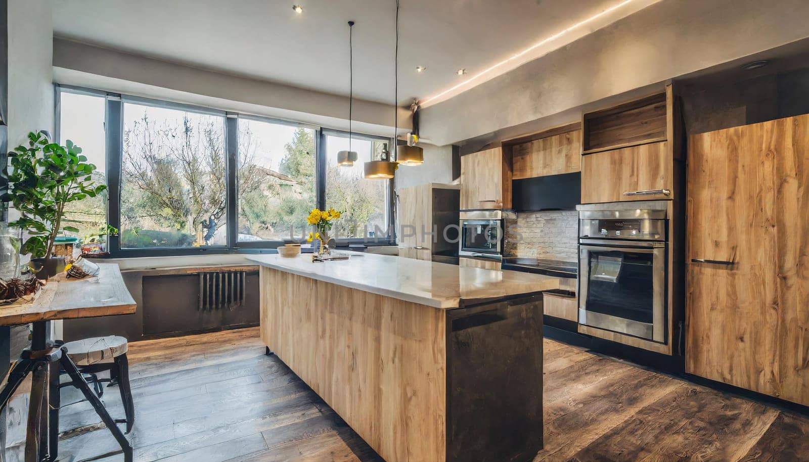 Cozy studio apartment with inviting interior featuring a comfortable brown sofa curtains and a cream colored kitchen with an island