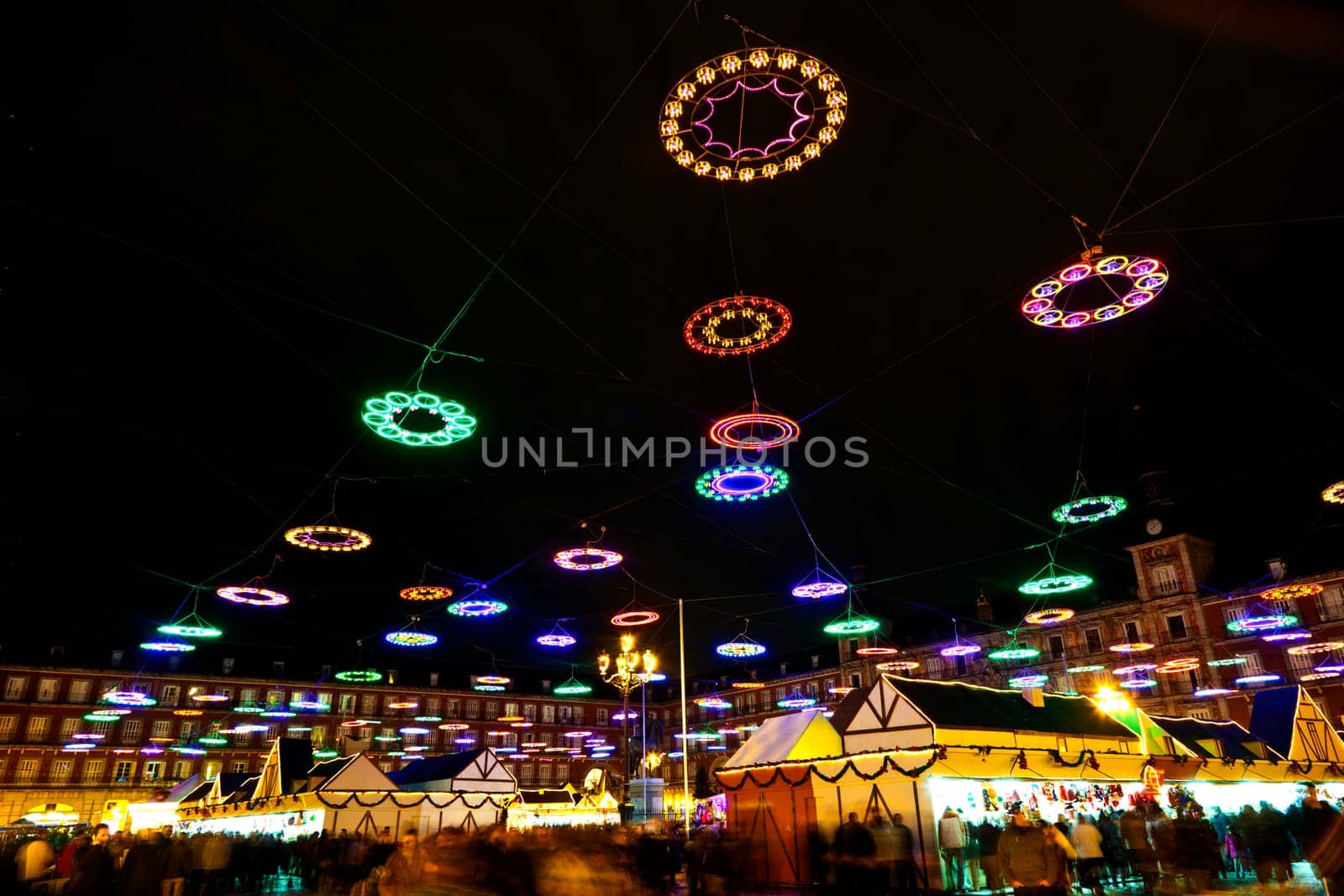 Madrid, Spain - December 20, 2010: christmas time at plaza de mayor in madrid in the night with illuminated stars