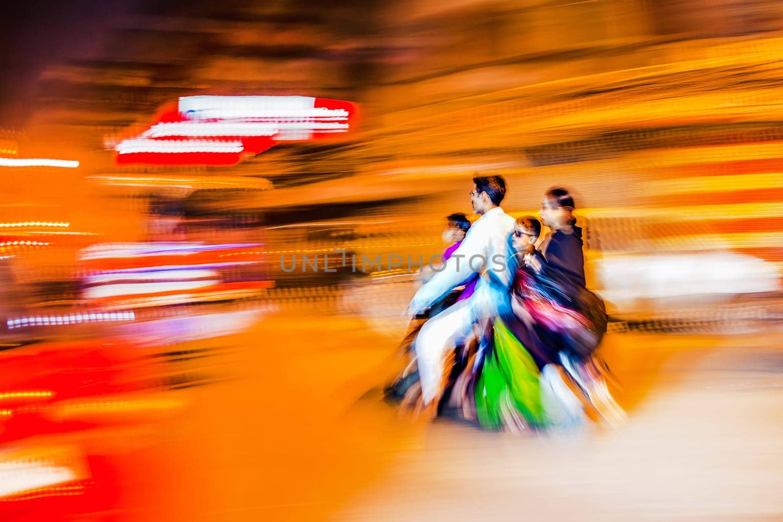 New Delhi, India - November 10, 2011:  motorbike driving in blurred motion by night in Chandni Chowk. The Chandni Chowk is one of the oldest and busiest markets in Old Delhi, India.