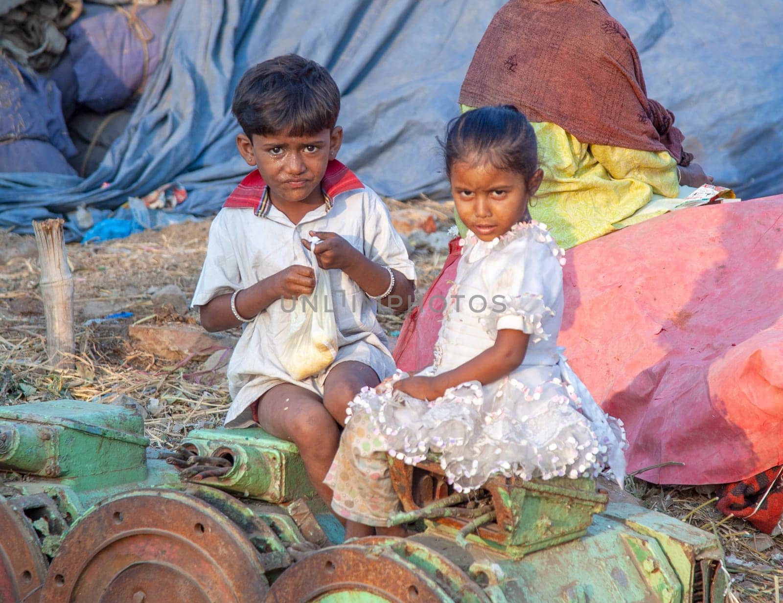 New Delhi, India - November 10, 2011:  portrait of young woman with child on arm  at  Meena Bazaar Market in Delhi, India. Shah Jahan founded the bazaar in the 17th century.