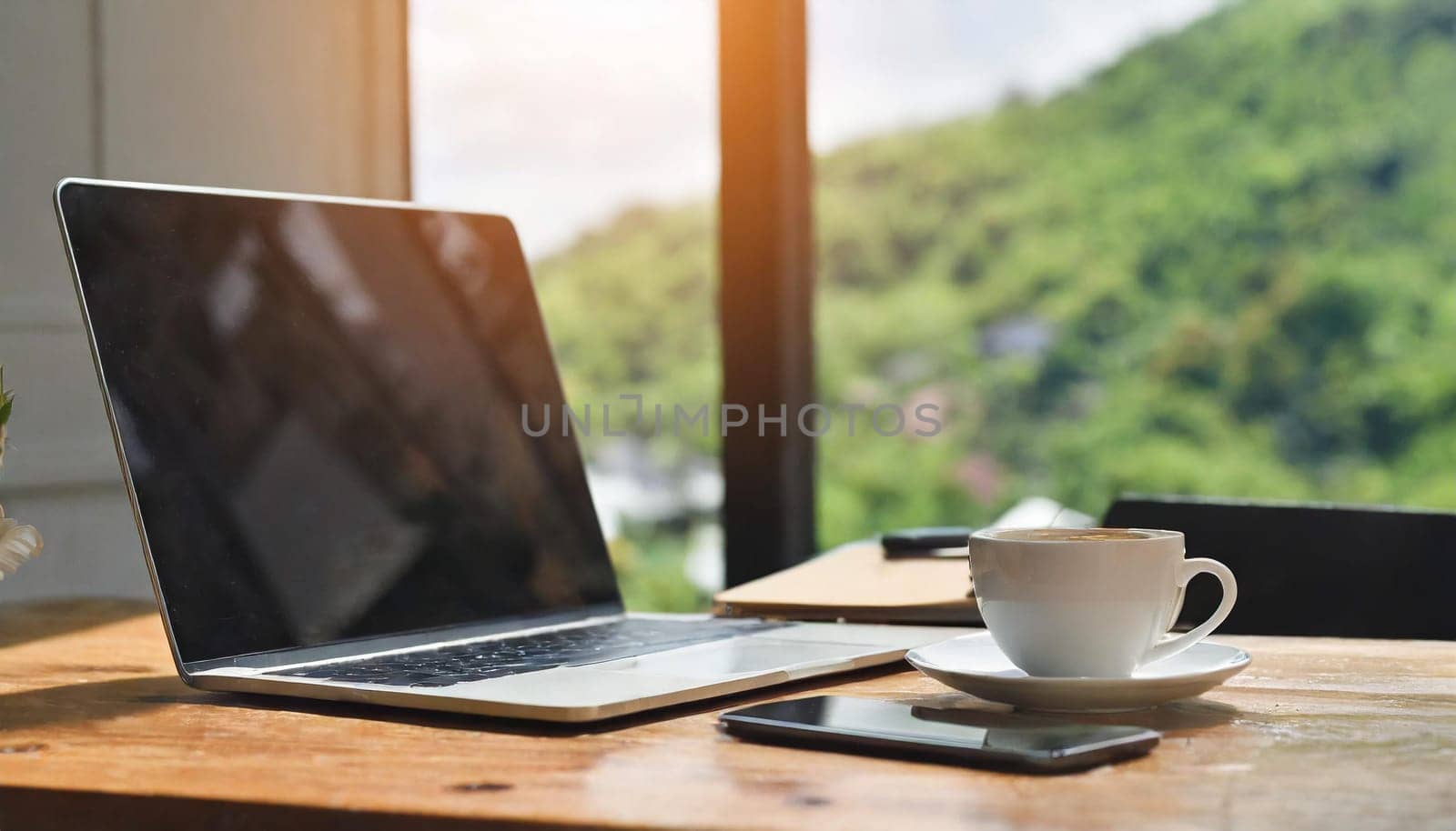 Modern workplace with laptop computer, coffee cup and office supplies