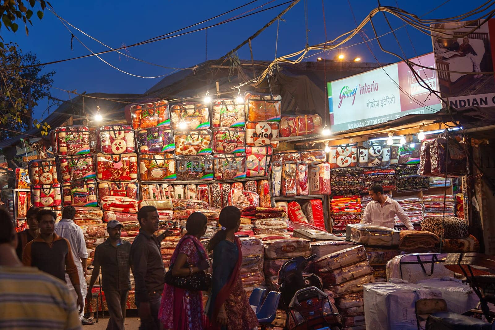 Delhi, India - November 10, 2011: people in the evening at the Meena Bazaar Market  in Delhi, India. Shah Jahan founded the bazaar in the 17th century inspired by the Isfahan Bazaar.