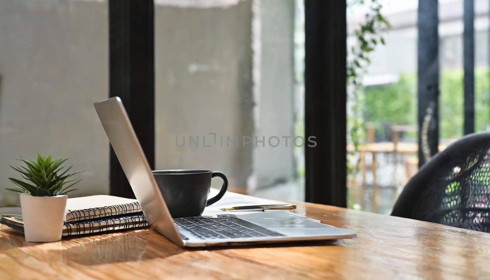 Wood office desk table with a lot of things tablet, laptop ,smartphone ,notepad and coffee cup notepad .copy space virtual interface icons screen.