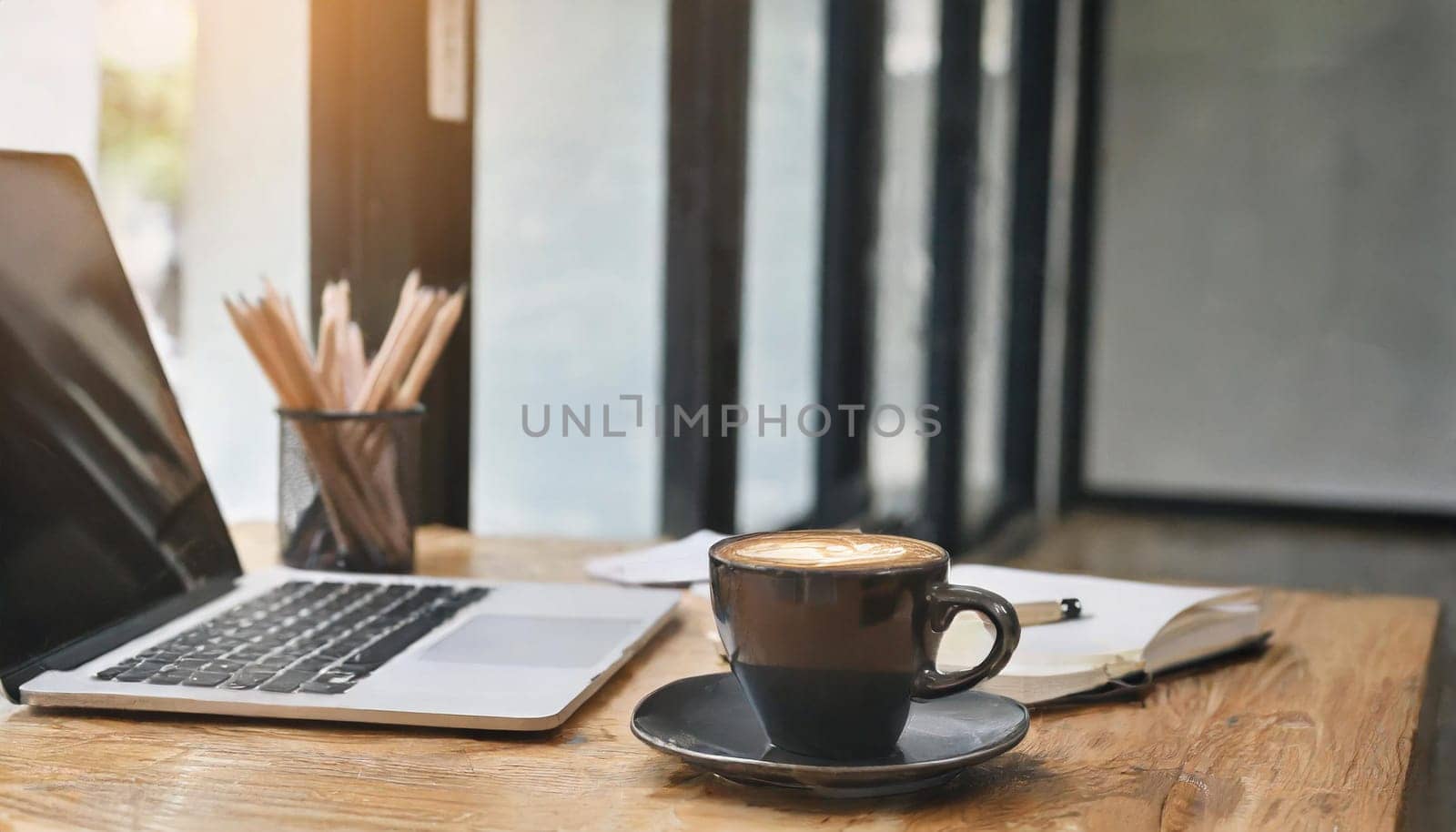 Wood office desk table with a lot of things tablet, laptop ,smartphone ,notepad and coffee cup notepad .copy space virtual interface icons screen.