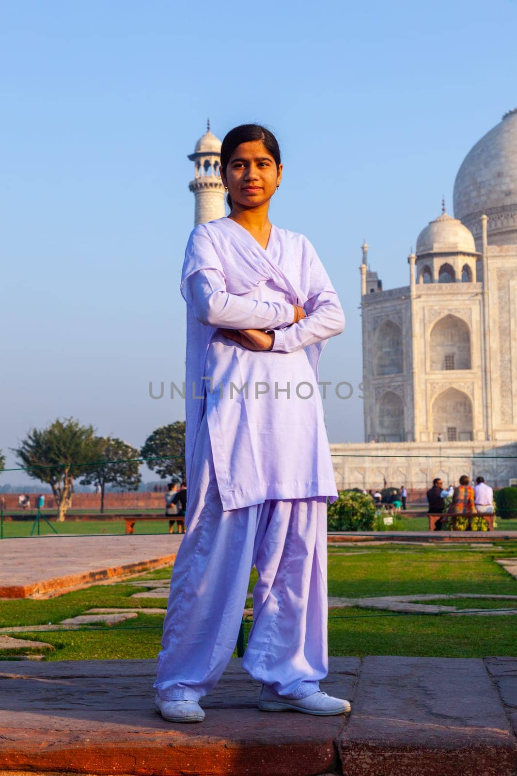 Agra, India - November 16, 2011: local tourists pose for a photo at the Taj Mahal in Agra, India. 2,5 Mio. local tourists visit the UNESCO World heritage site yearly.
