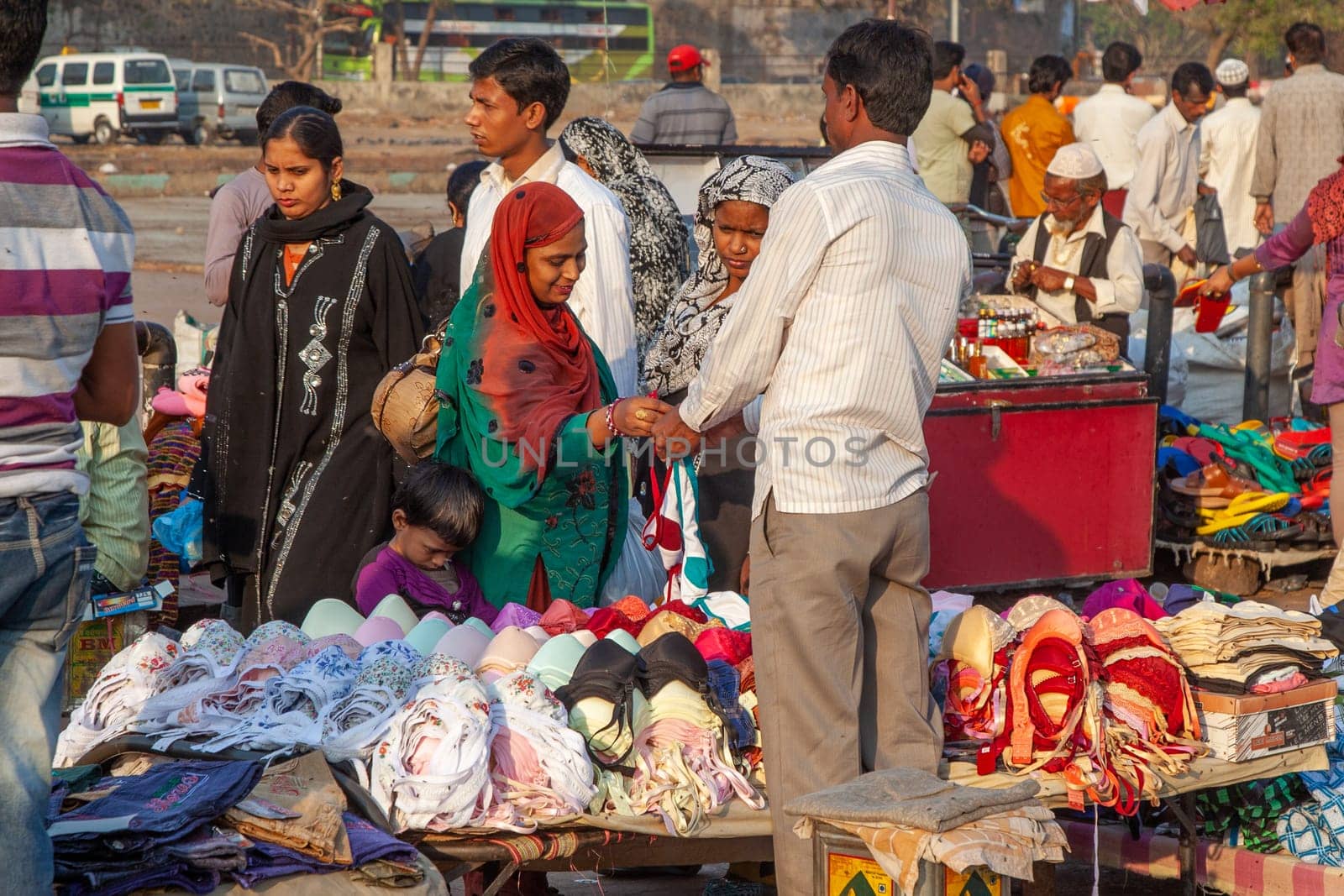 New Delhi, India - November 17, 2011: people at Meena Bazaar in Chandni Chowk area selling goods at the old open air market in India.