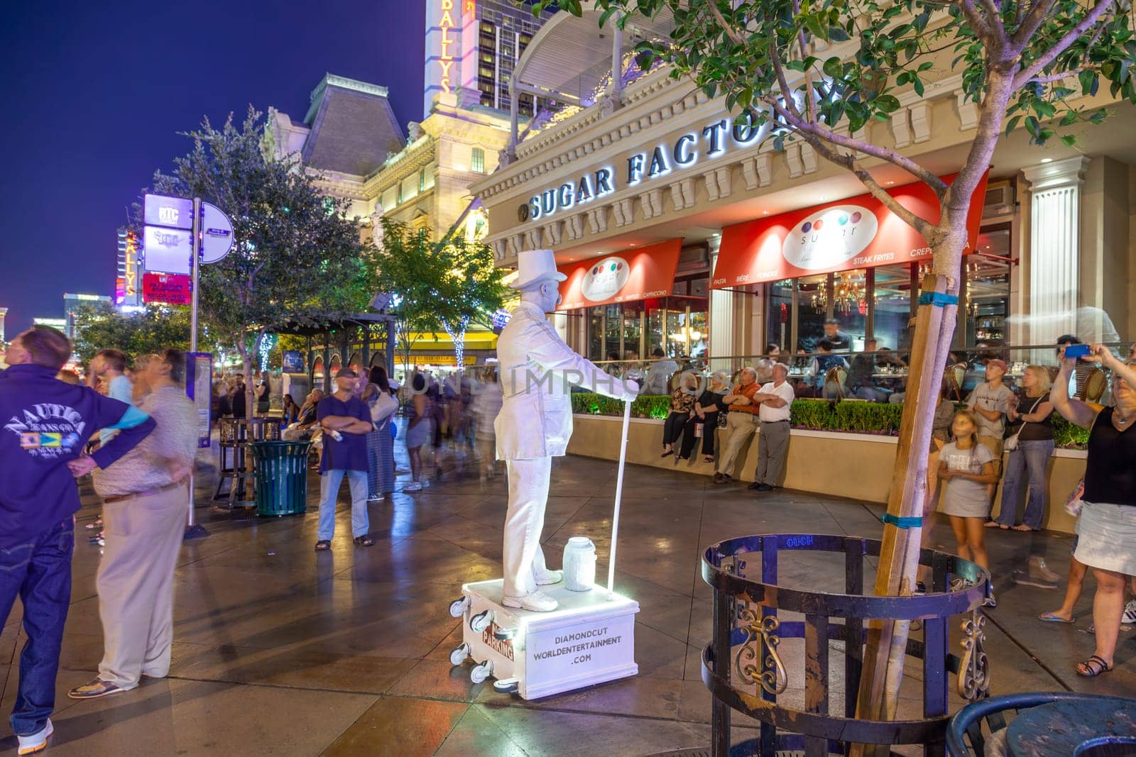 Las Vegas, USA - June 15, 2012: advertising for diamond cut and world entertainment at the Strip by night by a white movable statue.